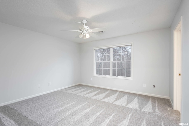 6800 Ridges Ct, Bettendorf, IA 52722 - carpeted empty room featuring a ceiling fan and baseboards