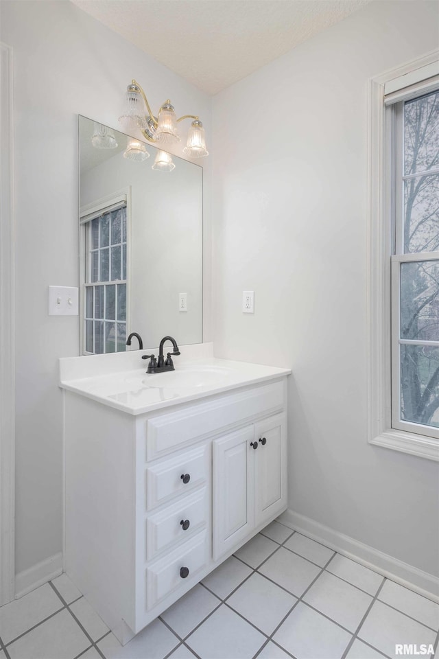 6800 Ridges Ct, Bettendorf, IA 52722 - bathroom featuring tile patterned flooring, vanity, and baseboards