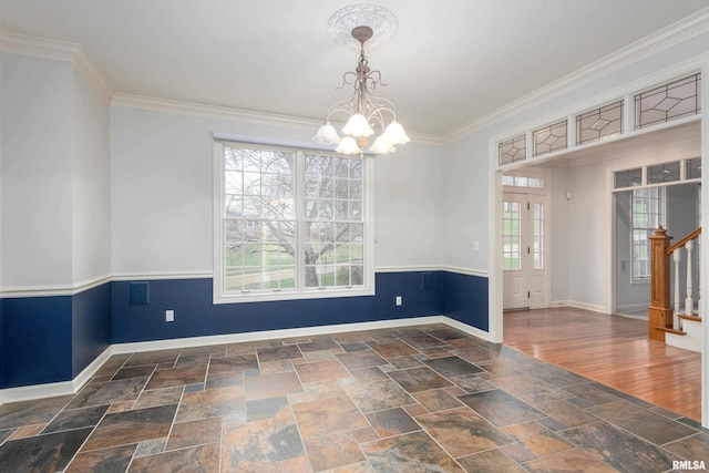 6800 Ridges Ct, Bettendorf, IA 52722 - empty room with plenty of natural light, a chandelier, baseboards, and ornamental molding