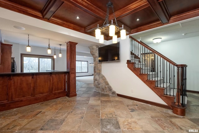 6800 Ridges Ct, Bettendorf, IA 52722 - staircase with coffered ceiling, baseboards, a chandelier, beamed ceiling, and decorative columns