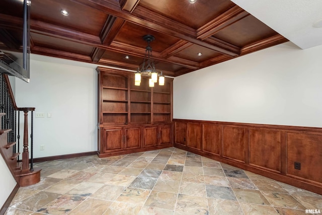 6800 Ridges Ct, Bettendorf, IA 52722 - spare room featuring stairs, beamed ceiling, light stone finish floors, coffered ceiling, and a chandelier