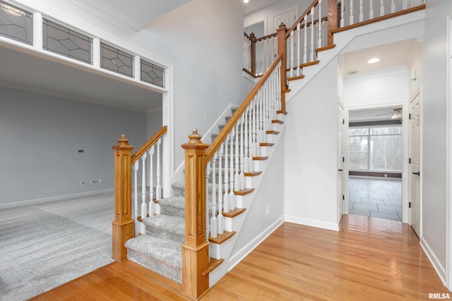 6800 Ridges Ct, Bettendorf, IA 52722 - staircase featuring wood finished floors, baseboards, recessed lighting, and crown molding