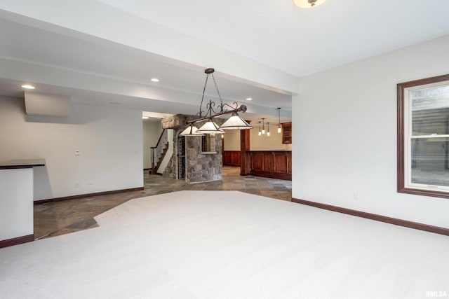 6800 Ridges Ct, Bettendorf, IA 52722 - unfurnished living room featuring baseboards, stairway, light carpet, and recessed lighting