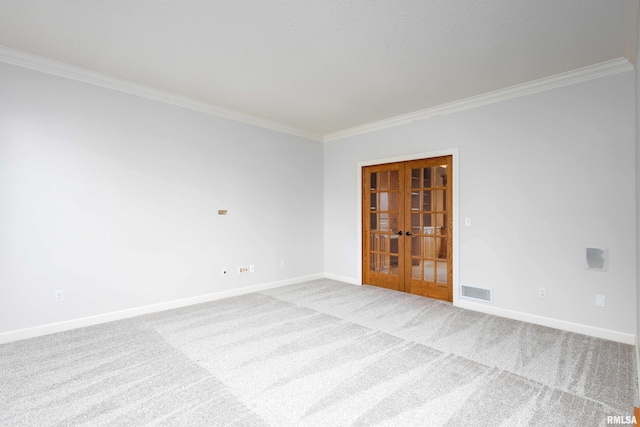 6800 Ridges Ct, Bettendorf, IA 52722 - carpeted spare room with french doors, crown molding, and baseboards