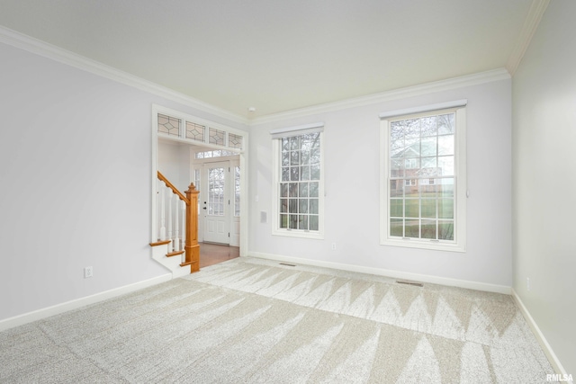 6800 Ridges Ct, Bettendorf, IA 52722 - carpeted spare room featuring crown molding, stairway, healthy amount of natural light, and baseboards