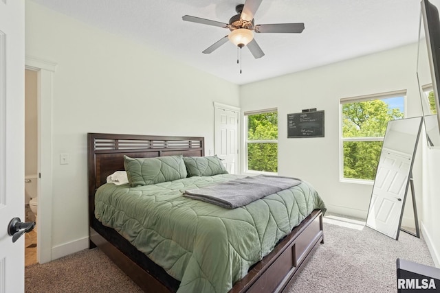 725 Cox Ct, Le Claire, IA 52753 - carpeted bedroom featuring multiple windows, baseboards, and a ceiling fan