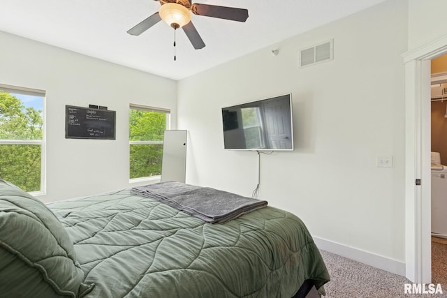 725 Cox Ct, Le Claire, IA 52753 - bedroom with carpet flooring, baseboards, and a ceiling fan