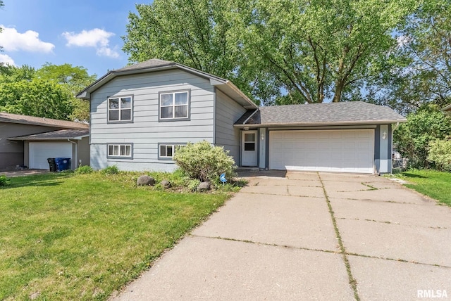 5812 N Thornwood Ave, Davenport, IA 52806 - tri-level home featuring an attached garage, a front lawn, and concrete driveway