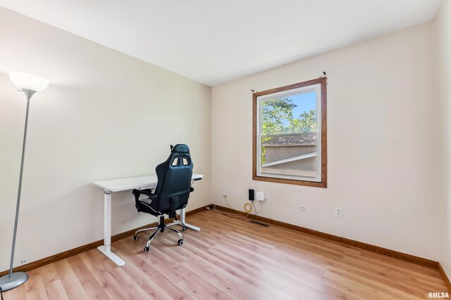 5812 N Thornwood Ave, Davenport, IA 52806 - unfurnished office featuring light wood finished floors and baseboards