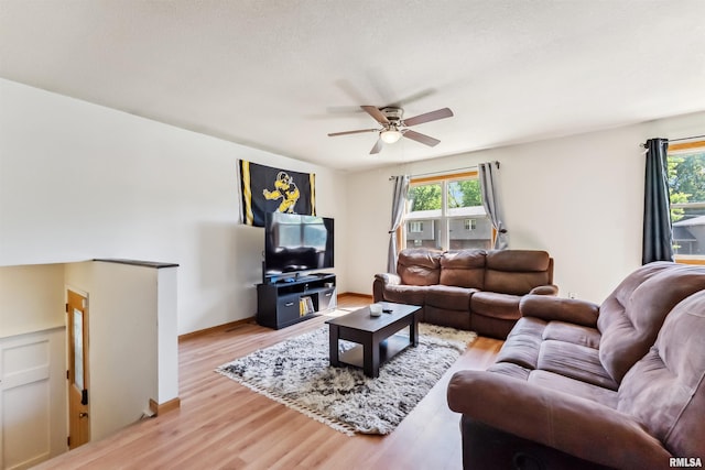 5812 N Thornwood Ave, Davenport, IA 52806 - living room featuring healthy amount of natural light, ceiling fan, and light wood-style floors