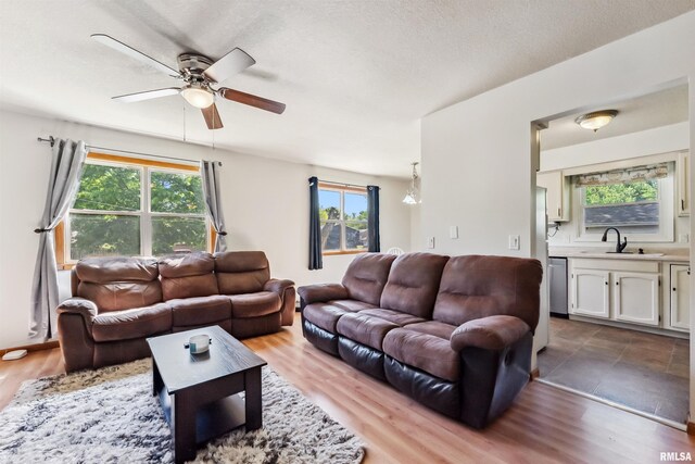5812 N Thornwood Ave, Davenport, IA 52806 - living area featuring a ceiling fan and wood finished floors