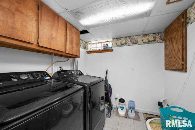 3430 W Locust St, Davenport, IA 52804 - clothes washing area featuring cabinet space and washer and dryer