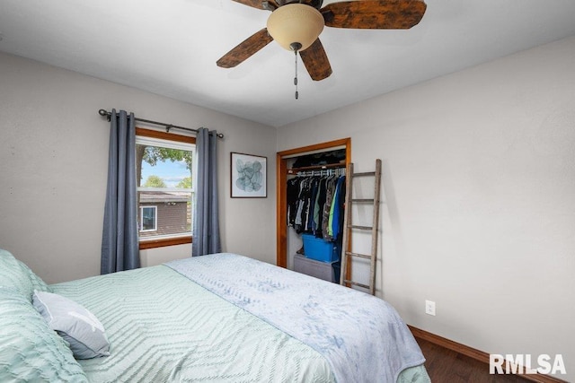 3430 W Locust St, Davenport, IA 52804 - bedroom featuring wood finished floors, a closet, baseboards, and ceiling fan