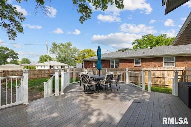 3430 W Locust St, Davenport, IA 52804 - wooden deck featuring outdoor dining space and a fenced backyard