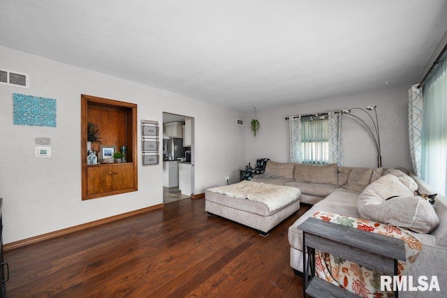 3430 W Locust St, Davenport, IA 52804 - living area featuring wood finished floors and baseboards