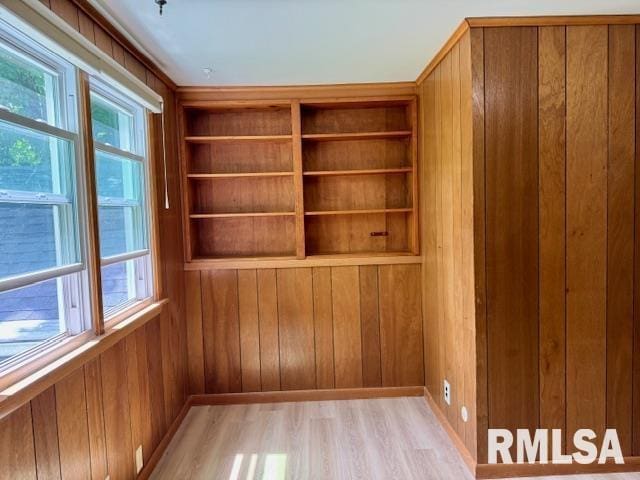 1003 16th Ave N, Clinton, IA 52732 - detailed view of wood finished floors, wooden walls, and baseboards