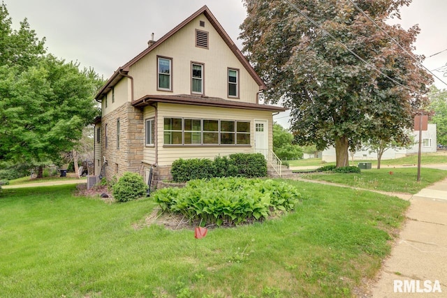 1845 S Bluff Blvd, Clinton, IA 52732 - view of home's exterior with stone siding and a yard
