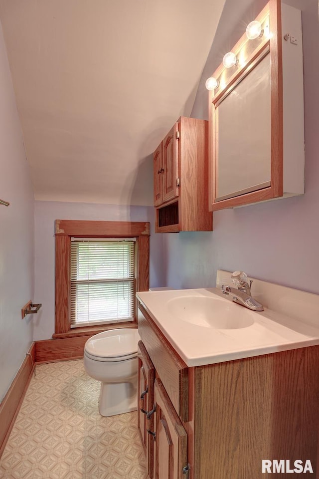 1845 S Bluff Blvd, Clinton, IA 52732 - half bath featuring toilet, vaulted ceiling, and vanity