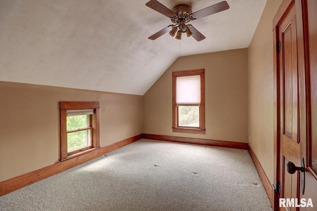 1845 S Bluff Blvd, Clinton, IA 52732 - additional living space with light carpet, vaulted ceiling, ceiling fan, and baseboards