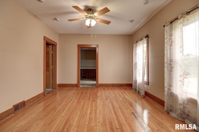1845 S Bluff Blvd, Clinton, IA 52732 - empty room with light wood-type flooring, ceiling fan, and baseboards