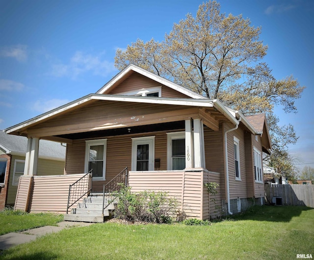 view of front of home with a porch and central AC unit