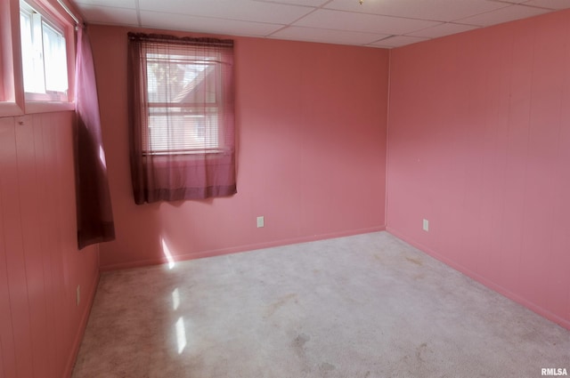 unfurnished room featuring baseboards and carpet flooring
