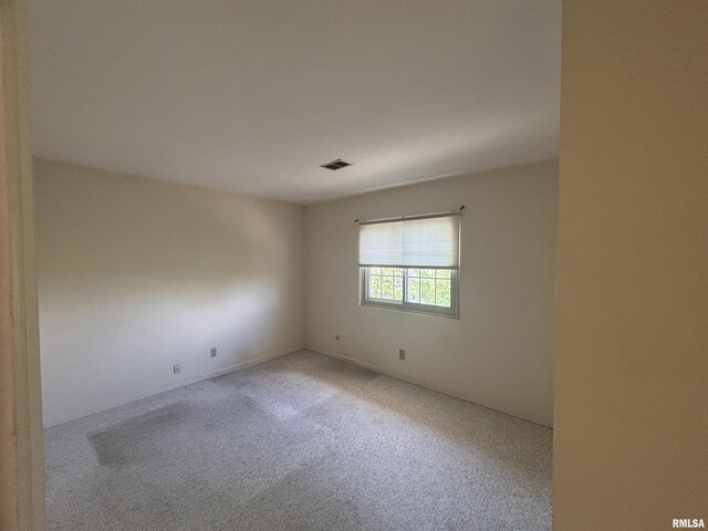 920 17th St Unit 28, Moline, IL 61265 - spare room with carpet floors