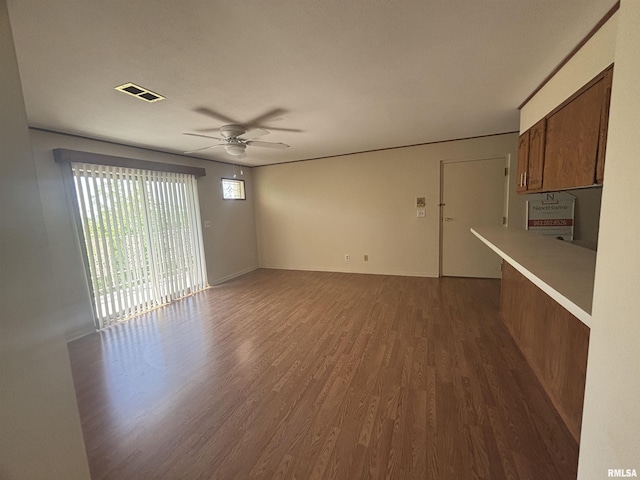 920 17th St Unit 28, Moline, IL 61265 - unfurnished living room with dark wood-type flooring and a ceiling fan
