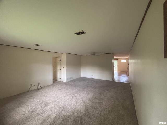 920 17th St Unit 28, Moline, IL 61265 - spare room featuring light colored carpet and a ceiling fan