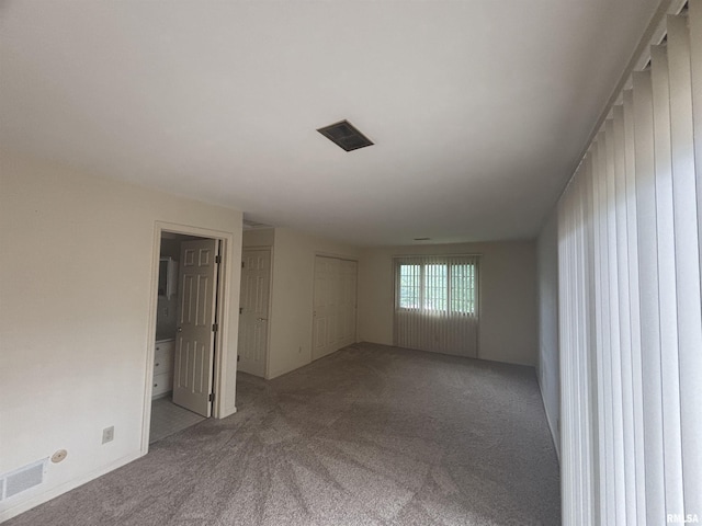 920 17th St Unit 28, Moline, IL 61265 - spare room with carpet floors