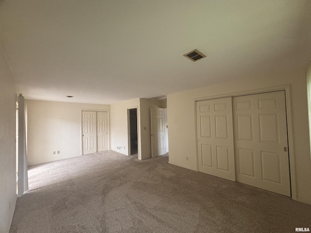920 17th St Unit 28, Moline, IL 61265 - unfurnished bedroom featuring carpet flooring