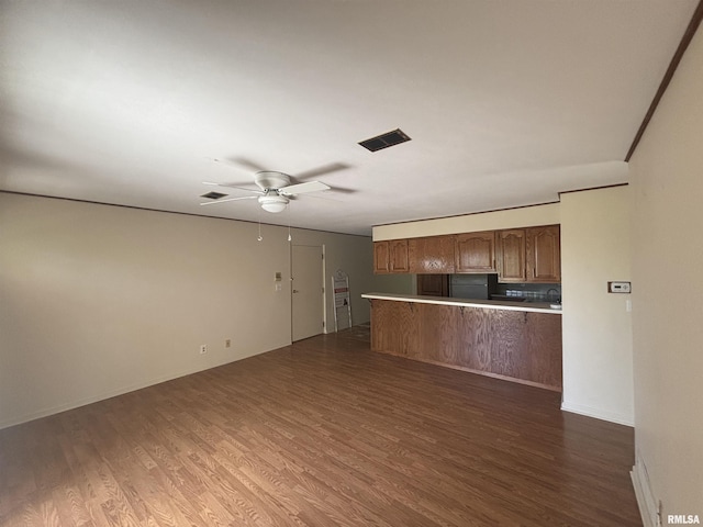 920 17th St Unit 28, Moline, IL 61265 - kitchen with dark wood-style flooring, ceiling fan, open floor plan, and light countertops