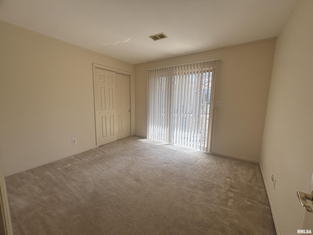 920 17th St Unit 28, Moline, IL 61265 - empty room featuring carpet flooring and baseboards