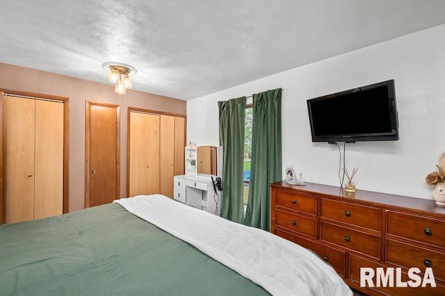 bedroom featuring two closets