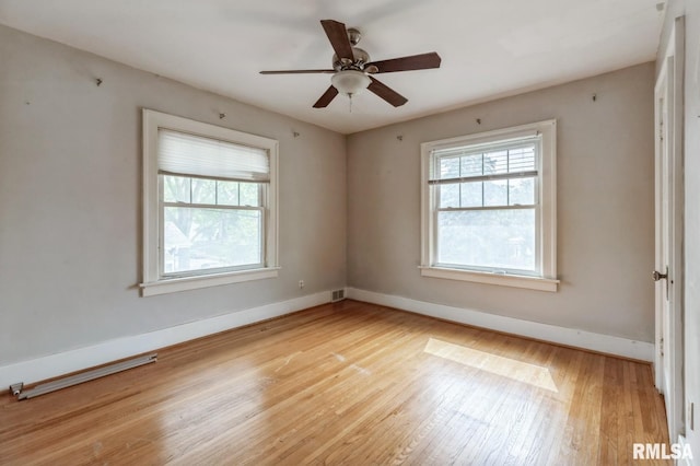 2505 Iowa St, Davenport, IA 52803 - spare room featuring light wood finished floors, baseboards, and ceiling fan