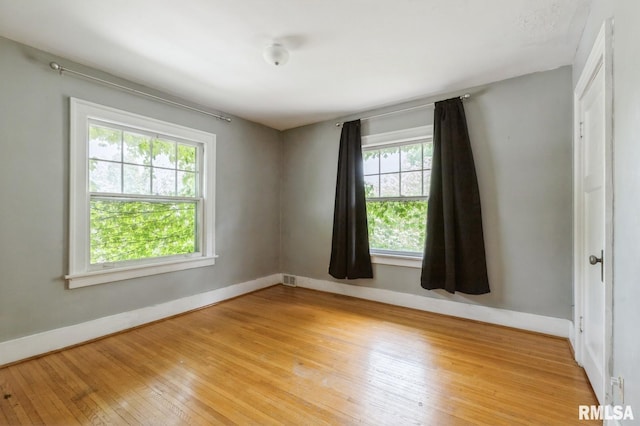 2505 Iowa St, Davenport, IA 52803 - unfurnished room featuring baseboards and light wood-style flooring