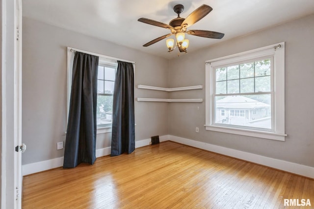2505 Iowa St, Davenport, IA 52803 - unfurnished room featuring healthy amount of natural light, light wood-style flooring, and baseboards