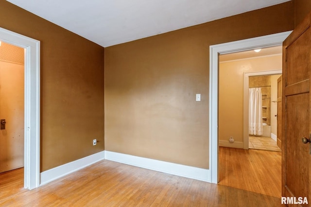 2505 Iowa St, Davenport, IA 52803 - empty room featuring light wood finished floors and baseboards