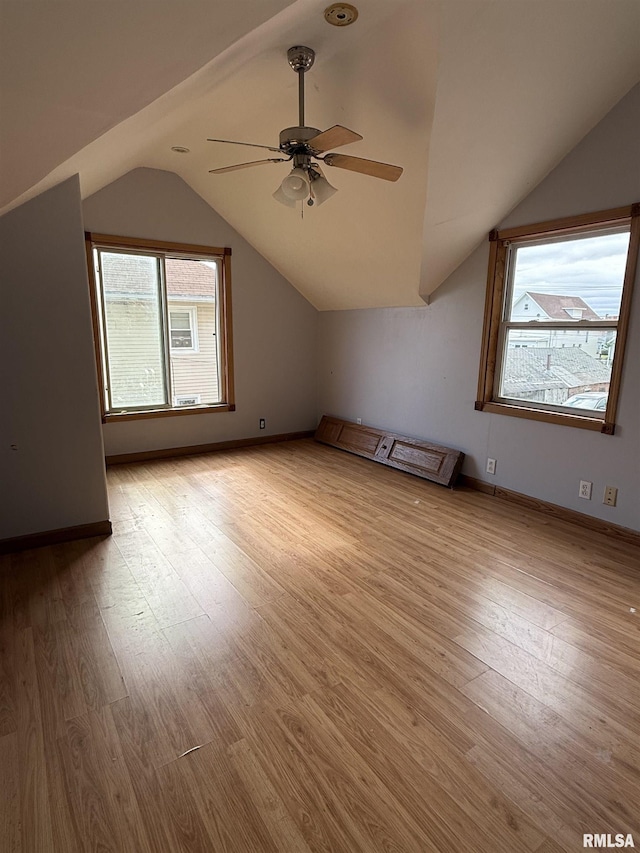 237 1st Ave, Clinton, IA 52732 - bonus room with lofted ceiling, wood finished floors, a ceiling fan, and baseboards