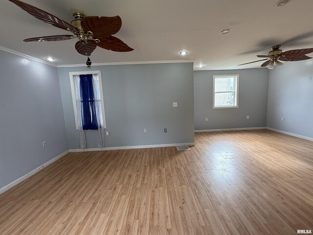 237 1st Ave, Clinton, IA 52732 - unfurnished room with a ceiling fan, crown molding, baseboards, light wood finished floors, and recessed lighting