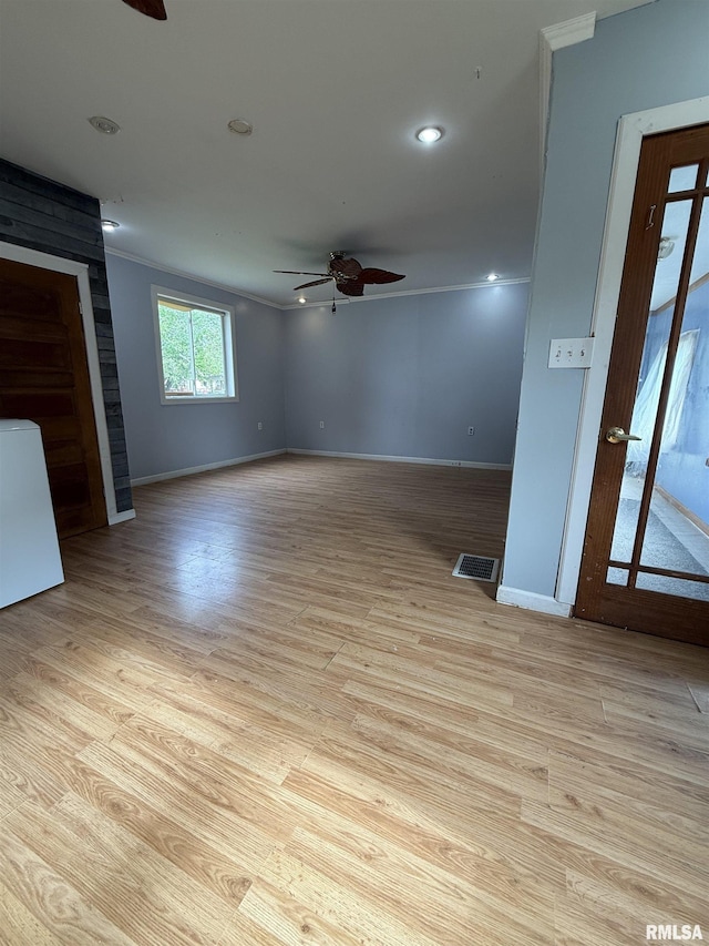 237 1st Ave, Clinton, IA 52732 - unfurnished room featuring ceiling fan, baseboards, light wood-type flooring, recessed lighting, and crown molding