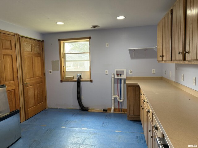 237 1st Ave, Clinton, IA 52732 - kitchen with light countertops, open shelves, and brown cabinets