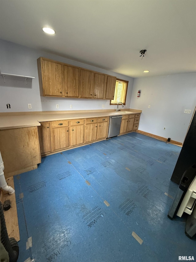 237 1st Ave, Clinton, IA 52732 - kitchen featuring dishwasher, a sink, light countertops, baseboards, and recessed lighting