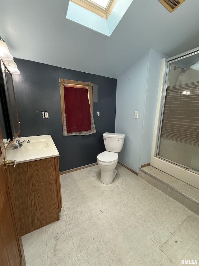 237 1st Ave, Clinton, IA 52732 - bathroom with a skylight, a stall shower, toilet, vanity, and vaulted ceiling