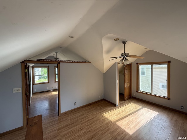 237 1st Ave, Clinton, IA 52732 - bonus room featuring ceiling fan, light wood-type flooring, vaulted ceiling, and baseboards