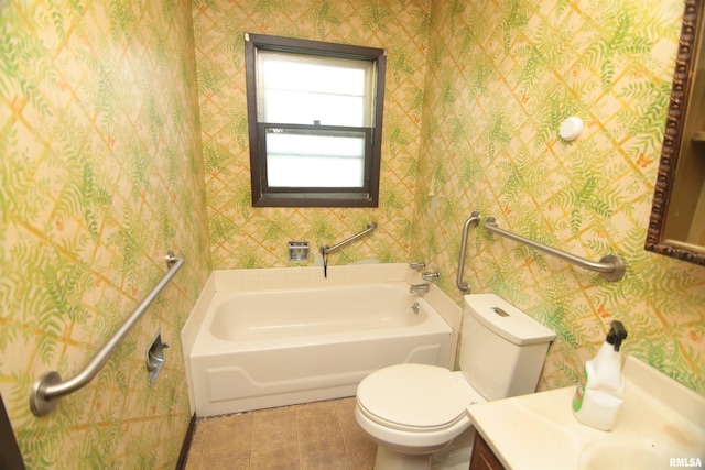 2630 N Concord St, Davenport, IA 52804 - bathroom with wallpapered walls, toilet, a tub, tile patterned flooring, and vanity