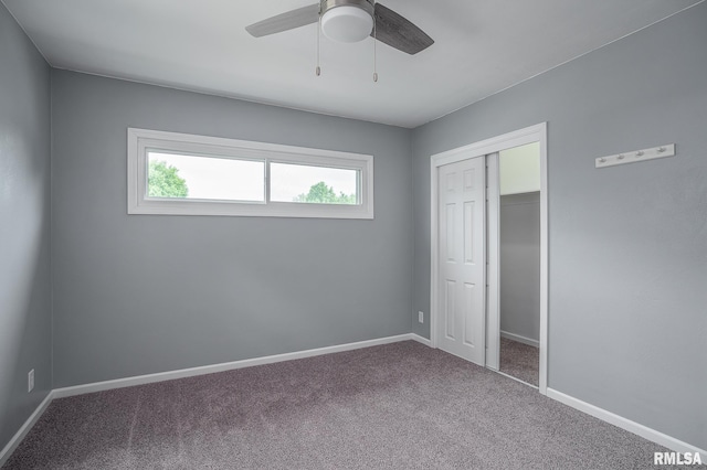 2845 Washington Ln, Davenport, IA 52804 - unfurnished bedroom with carpet floors, a closet, and baseboards