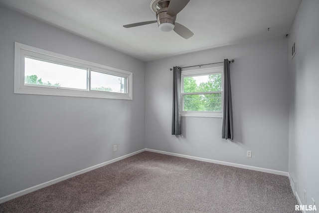 2845 Washington Ln, Davenport, IA 52804 - unfurnished room with ceiling fan, carpet floors, and baseboards
