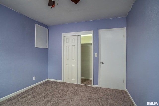 2845 Washington Ln, Davenport, IA 52804 - unfurnished bedroom with carpet floors, baseboards, a closet, and ceiling fan