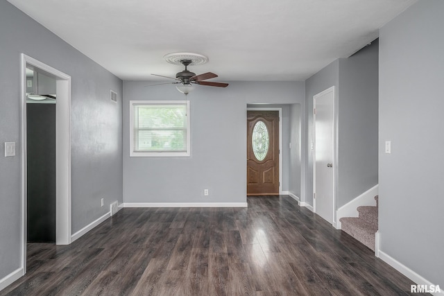 2845 Washington Ln, Davenport, IA 52804 - foyer featuring dark wood-style flooring, ceiling fan, stairs, and baseboards